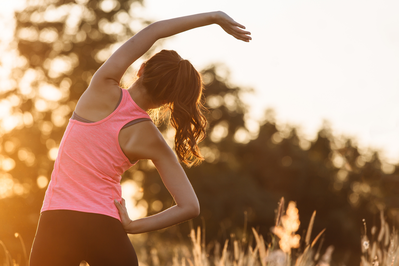 athlete completing pre-workout stretches