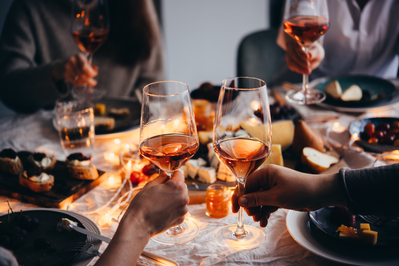 wine cheers at a dinner with friends 