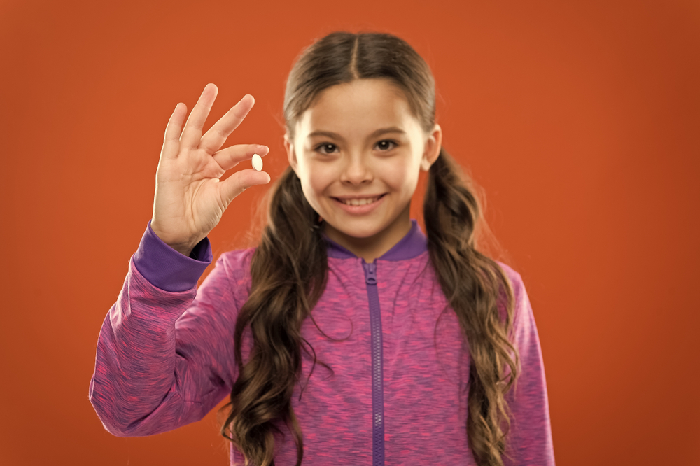 young girl with supplement