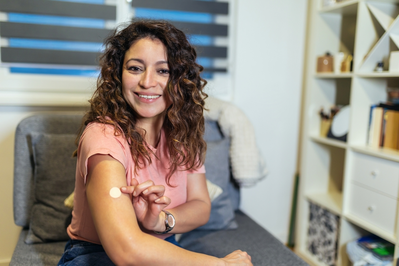 happy woman with patch on arm hrt