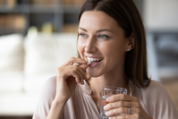 woman taking supplement