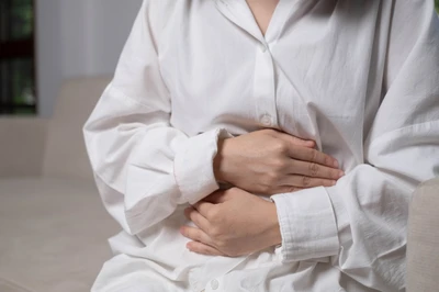 woman holding stomach