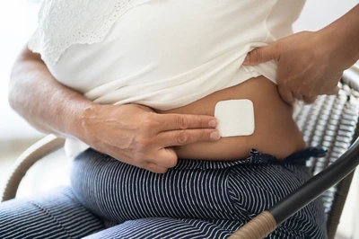 woman with a patch on her abdomen